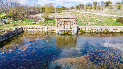 Fototapeta na wymiar Eflatun Pınar is the name given to a spring, which rises up from the ground, and the stone-built pool monument built at the time of the Hittite Empire inside the Lake Beyşehir National Park, Konya
