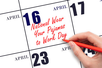 April 16. Hand writing text National Wear Your Pajamas to Work Day on calendar date. Save the date.