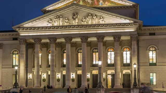 Munich National Theatre or Nationaltheater on Max Joseph square day to night transition timelapse. Historic opera house, home of the Bavarian State Opera. Evening illumination after sunset. Germany