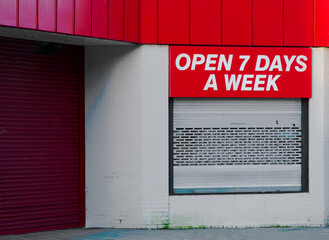Open 7 days a week sign above business store front