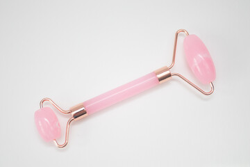 Roller Facial Massager pink on white background