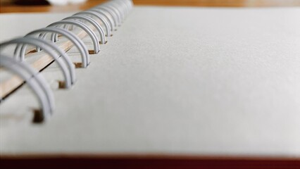 Pencil and notebook lying on desk