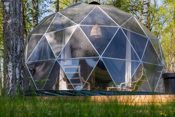 Glamping modern type of outdoor recreation with all the amenities. Glamping in a birch forest on...