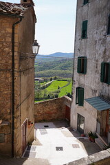 Obraz premium Chiusdino, Siena, Tuscany, Italy - Typical tuscan historical town with narrow street and terracotta bricks.