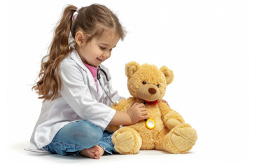Little girl playing doctor with teddy bear isolated on white background