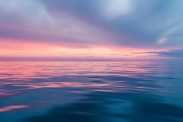 Naklejka na ściany i meble Serenity at Sunrise: Calm Ocean Waters Under Colorful Skies