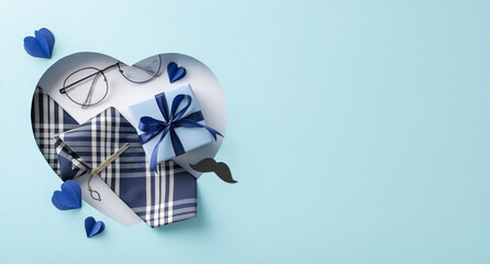 Celebrate Dad with a stylish ensemble: top view of necktie, bow tie, clip, glasses and more, framed in a heart-shaped cutout. Perfect for Father's Day greetings or ads on a pastel blue backdrop