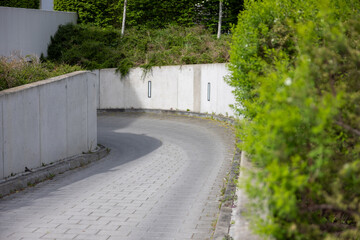 Garage entrance road with road lights