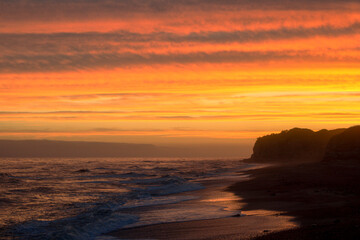 Golden Horizon: An Orange Sunset at the Beach