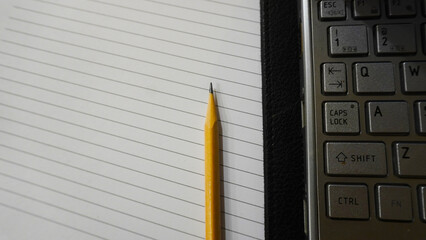 Pencil and paper of writing book for template background , banner , web , pamphlet and brochure	