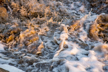 Water splashes with foam, closeup view