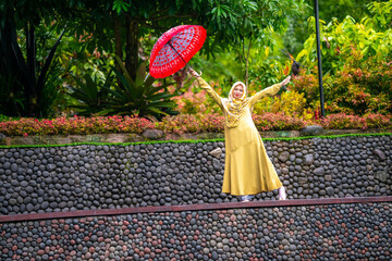 women playing umbrella