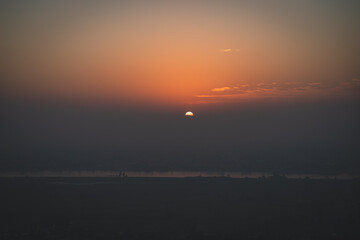Luxor, Egypt - October 27, 2022. Sunrise over the NIle river from the balloon near Luxor. - 783867361