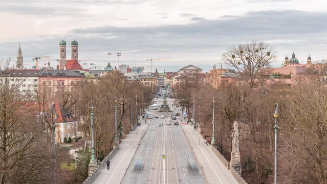 Panoramic aerial view from Maximilianeum timelapse with driving cars and tramway on Maximilian Bridge and Maximilianstrasse, Munich, Germany. Famous landmarks in a distance
