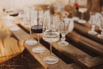 Wooden table with glassware arranged for picnic
