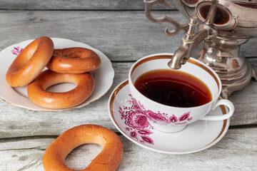 cup of tea from a samovar with bagels - obrazy, fototapety, plakaty