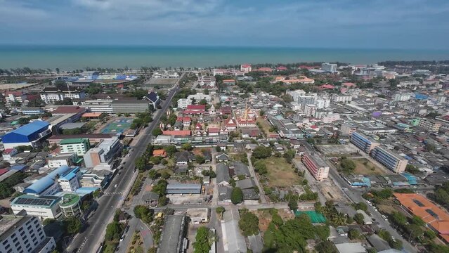 Arieal view of Songkhla Thailand while flying from the sea into a town 
