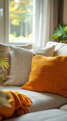 Detail shot of a decorative throw pillow arrangement on a sofa, scandinavian style interior