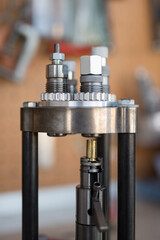 Detail of the Belling or Expanding process of a 9mm case in the reloading press with the expanding...