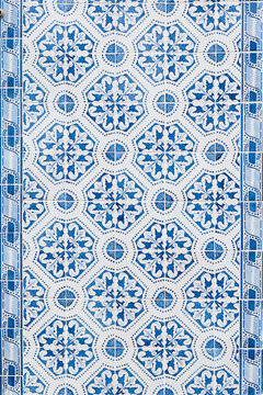 Framed mosaic of portuguese tiles in blue abstract shapes. 