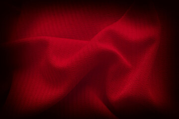 A crumpled red fabric background. Close up.
