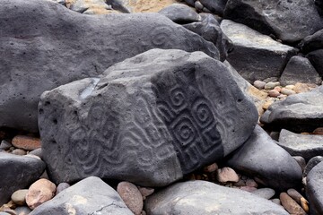 Carved stone on the beach at Las Labradas, Mexico