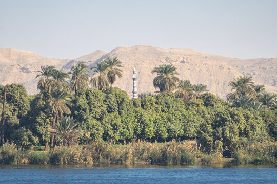 Minaret of a mosque along the  Nile river bank in Egypt 