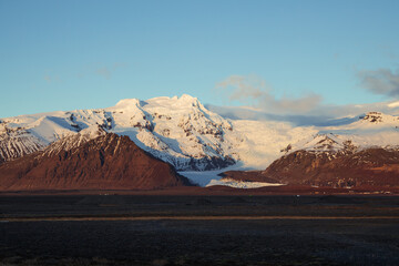 icelandic mountains with snow at the sunset  - obrazy, fototapety, plakaty