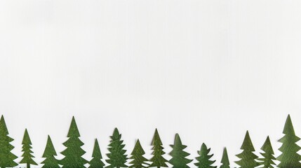 Obraz premium Colorful paper art forest and mountains. A creative panoramic paper art of a forest with bright colored trees against white mountains and a backdrop. Great for christmass postcard design inspiration