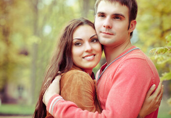 Fototapeta premium Portrait of couple enjoying golden autumn fall season