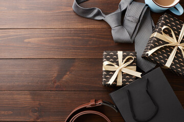 Father's day gift essentials concept. Top view of presents and coffee on dark wooden background