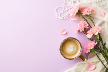 Mother's day theme: top view of carnations and coffee, spring scarf and paper hearts on a pastel...