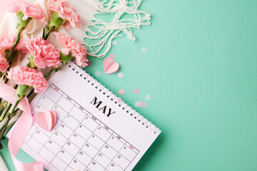 Mother's day schedule: bright calendar with pink carnations on a turquoise background, perfect for custom greetings