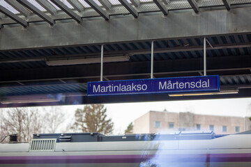 Martinlaakso tarin station sign. Photographed from the train.