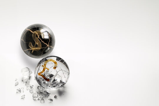 A glass ball with a dollar sign, while Pound shattered into pieces.