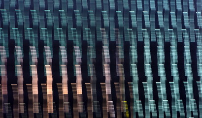 Colorful ribbons pattern during long exposure of blinds.