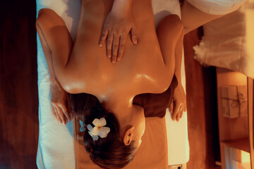 Top view woman customer enjoying relaxing anti-stress spa massage and pampering with beauty skin...