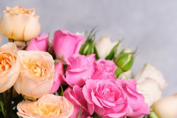 Beautiful bouquet of pink roses on a gray background. Close-up.
