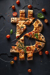 Artistic representation of Bitcoin symbol topped with pizza toppings. Payment by Bitcoin