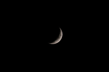 The moon (in a waxing crescent moon phase, a 