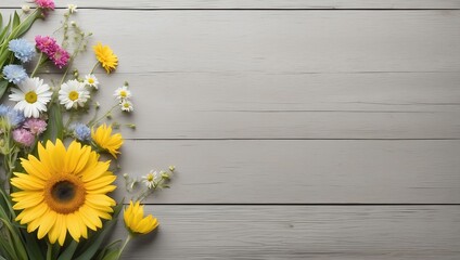 yellow flowers on wooden background with copy space 