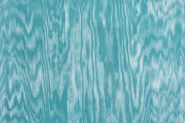 blue green wooden wall background with pattern in white waves