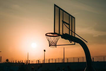 PhotoStock Basketball hoop against sunset sky, street ball competition ambiance