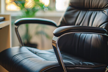 Close up of black office chair with armrest - obrazy, fototapety, plakaty