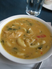 A bowl of creamy turkey pasta soup.