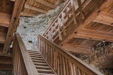 Wooden stairs in the old castle. Interior of medieval castle.