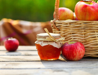 Apples in a basket on wooden table