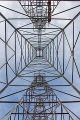 View of blue sky from under the iron oil derrick in Kilgore, Gregg and Rusk counties, Texas, USA