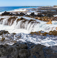 Waves Washing Over The Rocky Volcanic Shoreline at Wawaloli Beach, Wawaloli Beach Park, Hawaii Island, Hawaii, USA