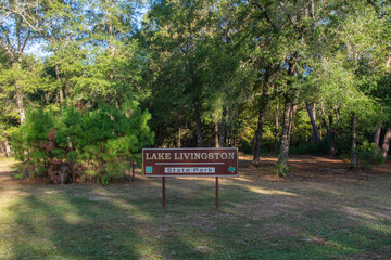 Lake Livingston State Park sign at the entrance to the park near Lake Livingston reservoir located in the East Texas Piney Woods in Polk County, Texas, United States